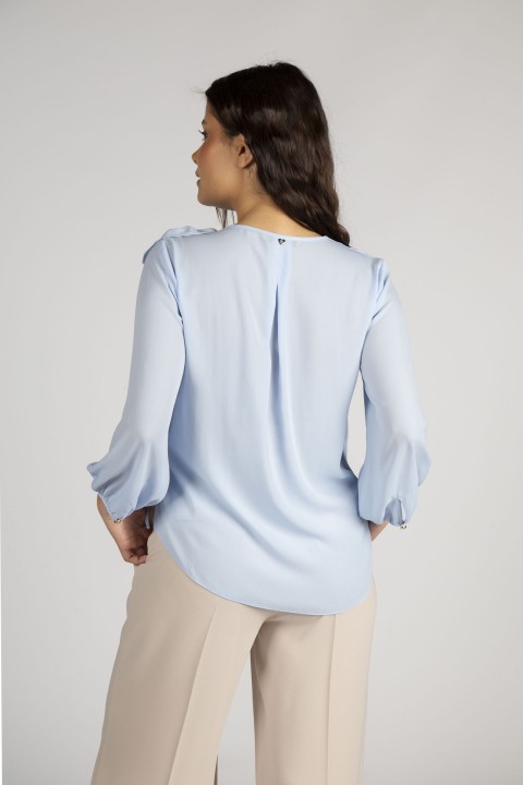 Tnica com flor tridimensional