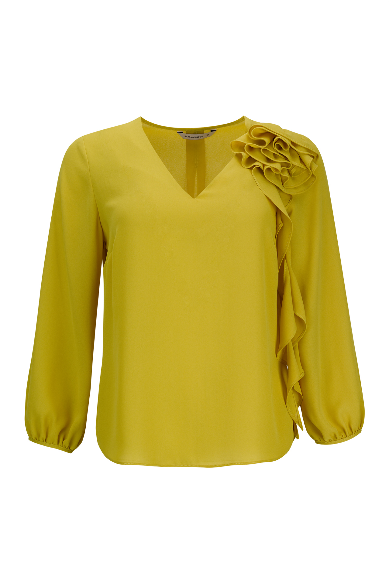 Túnica con flor tridimensional