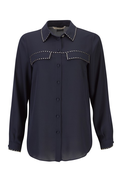 Blusa con tachuelas doradas