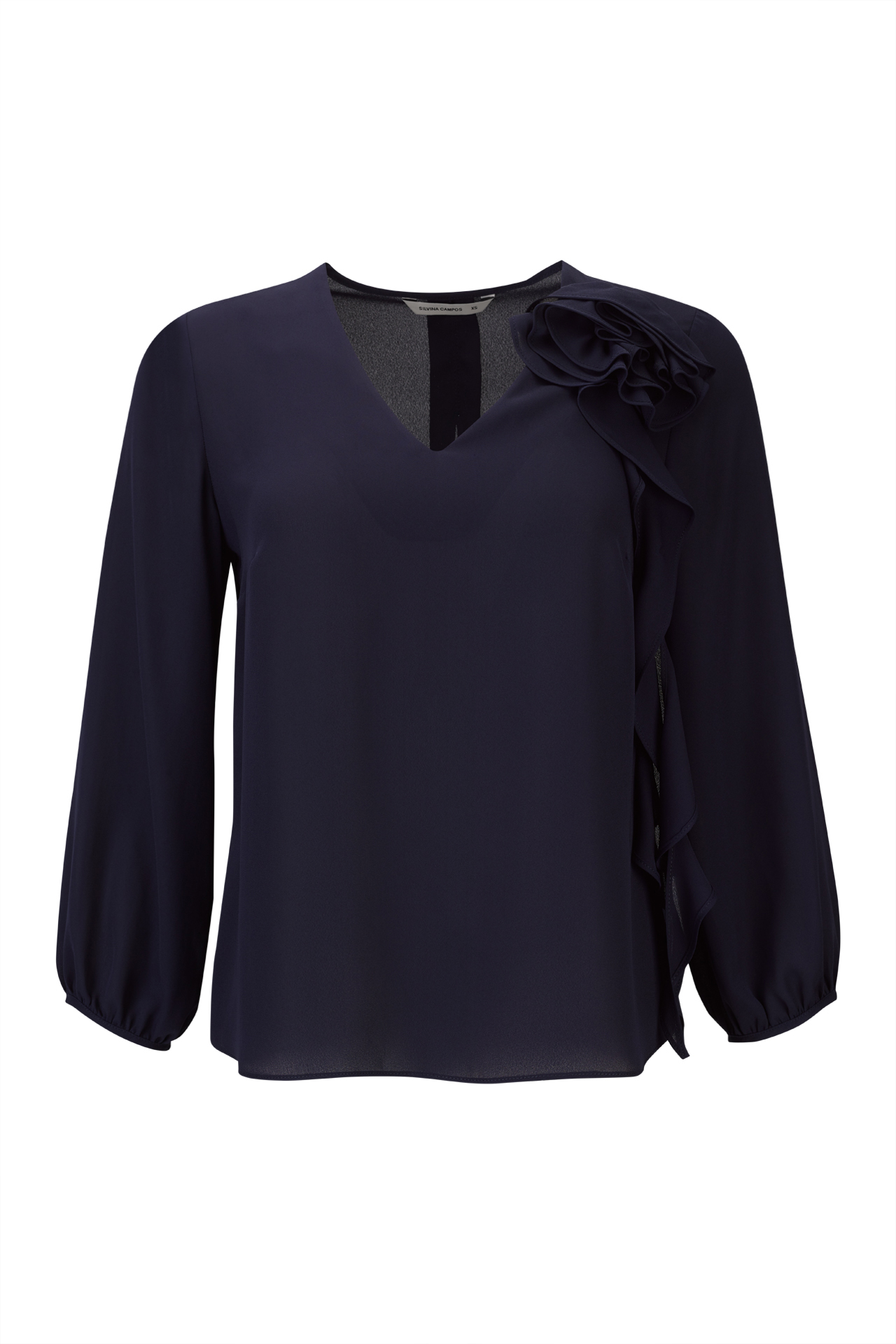 Túnica con flor tridimensional