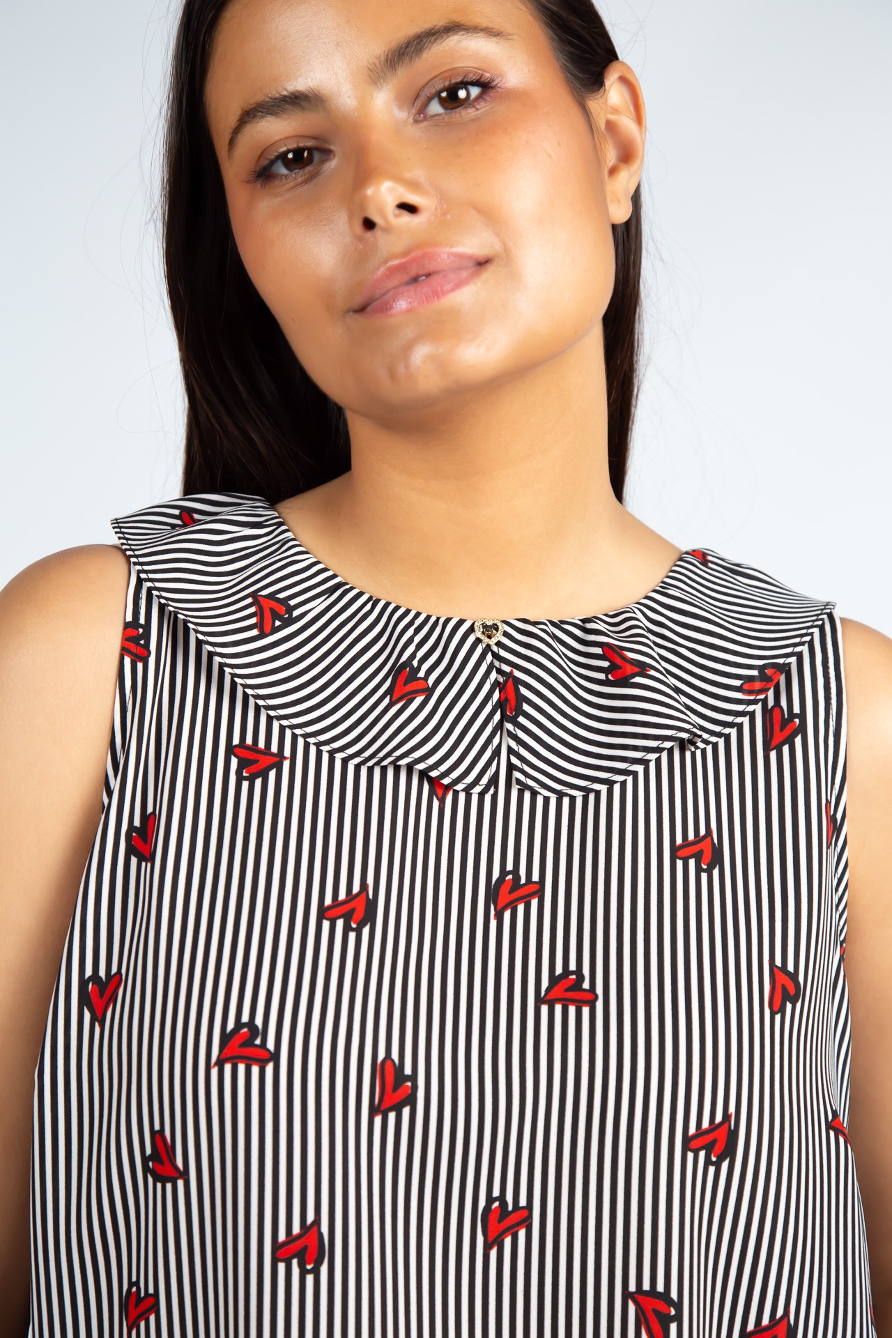 Sleeveless top with ruffle