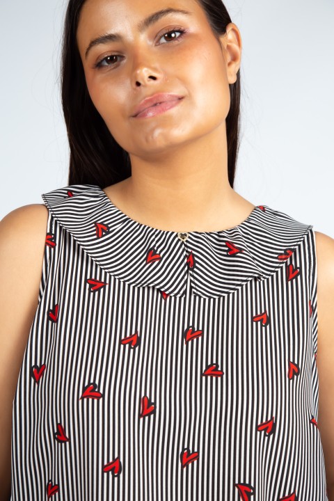 Sleeveless top with ruffle Sleeveless top with ruffle