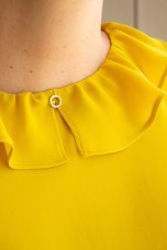 Sleeveless top with ruffle