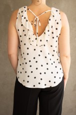 Sleeveless top with ruffle