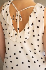 Sleeveless top with ruffle