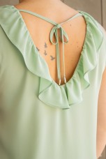 Sleeveless top with ruffle