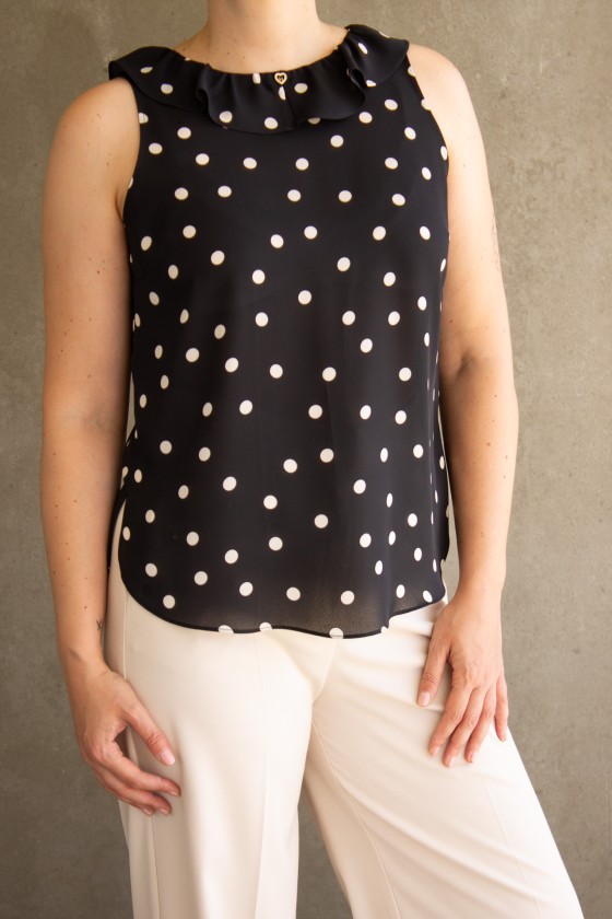 Sleeveless top with ruffle