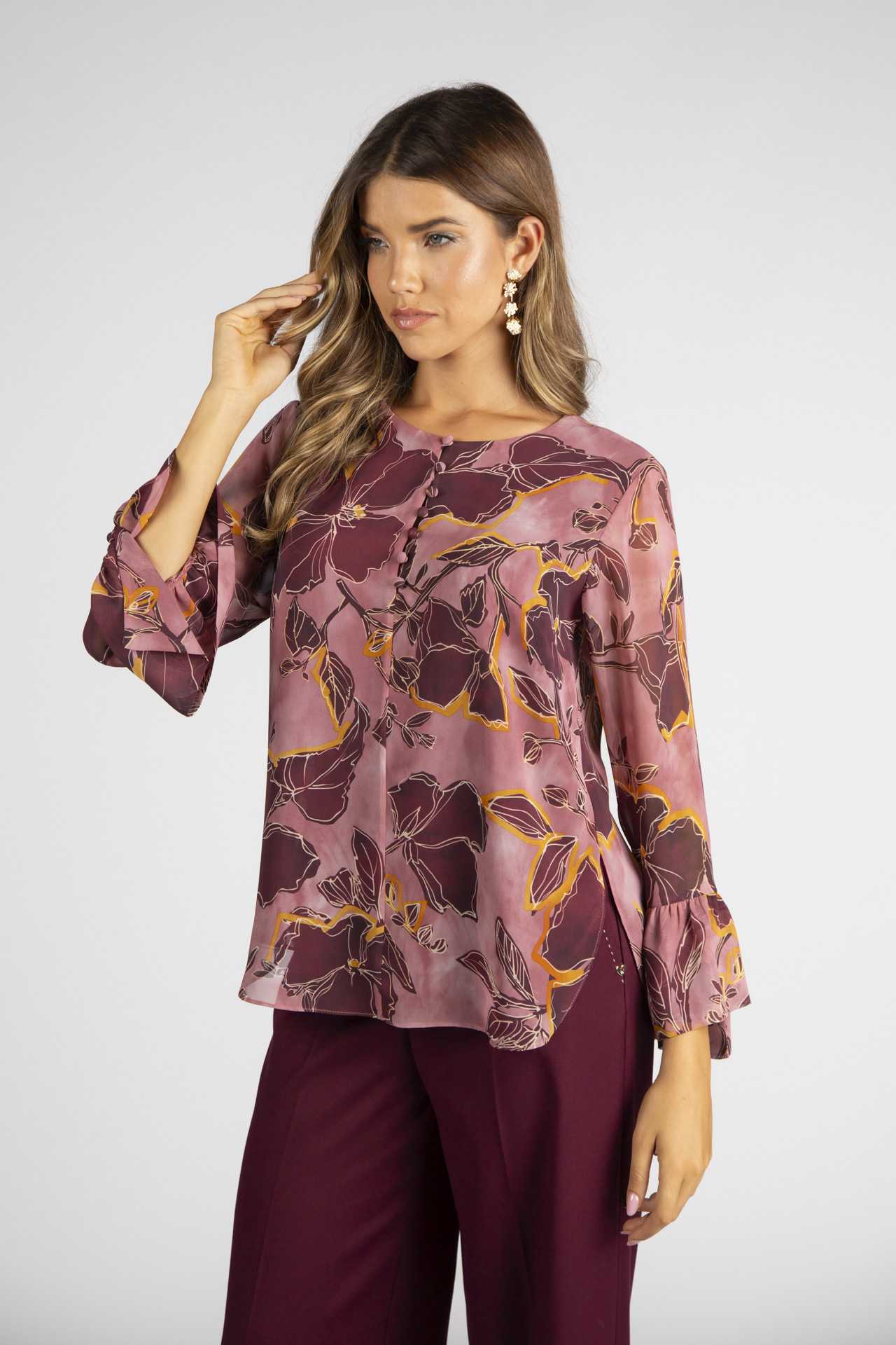 Túnica de botões forrados