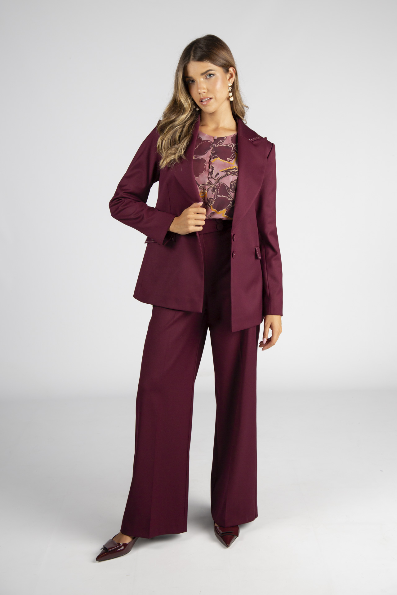 Túnica de botões forrados