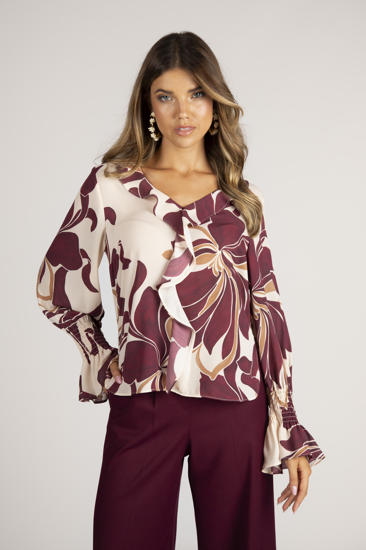 Blouse with ruffles and elasticated cuffs