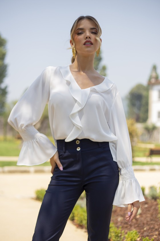 Blouse with ruffles and elasticated cuffs