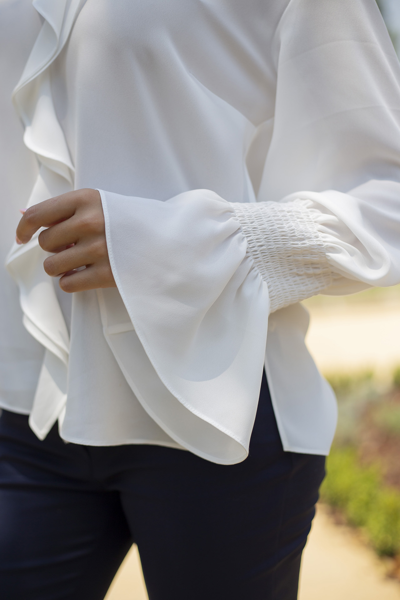 Blouse with ruffles and elasticated cuffs