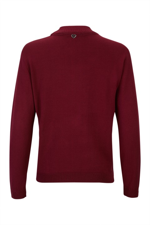 Knitted jumper with twisted collar