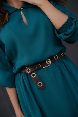 Belt with metallic eyelets