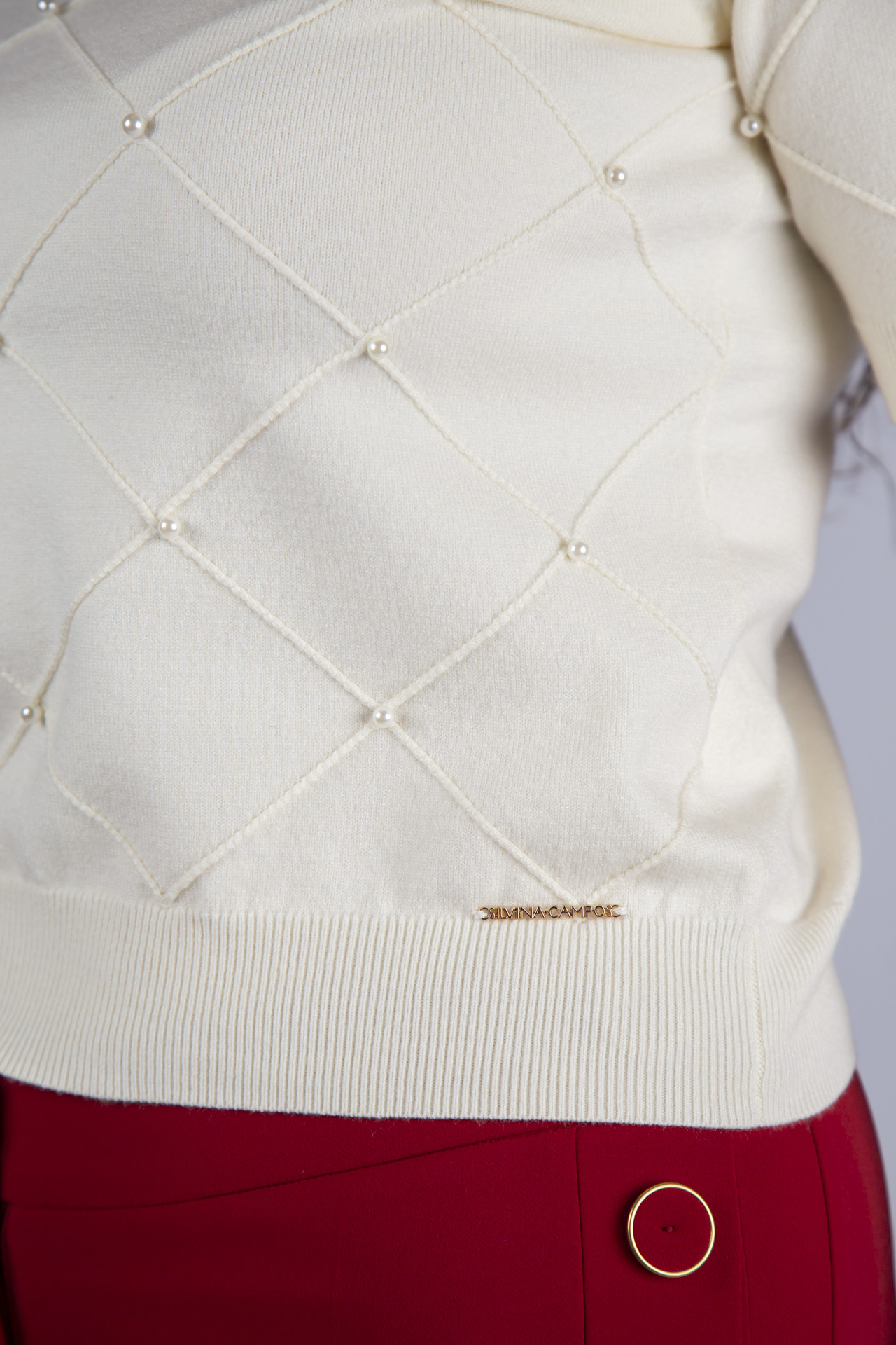 Casaco de malha perolas