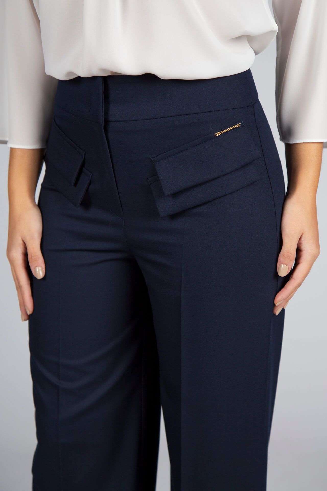Trousers with double front flap