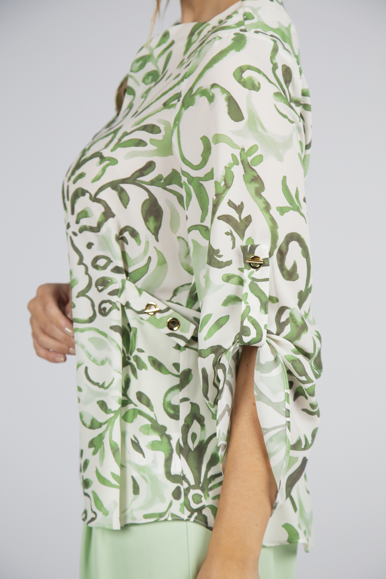 Túnica ilhós dourados