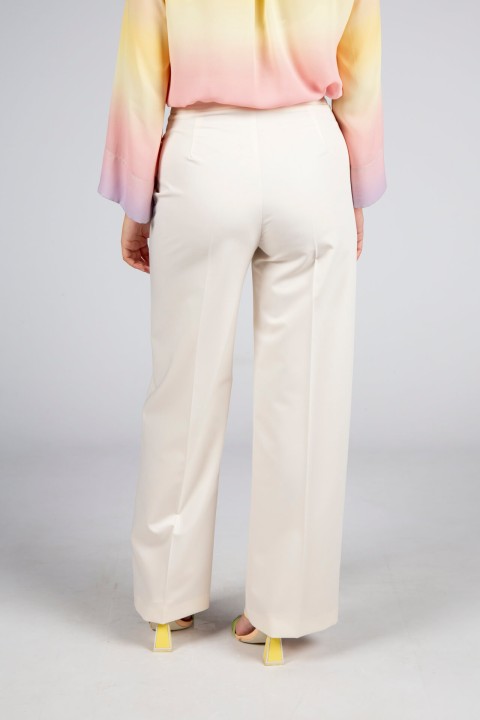 Trousers with double front flap