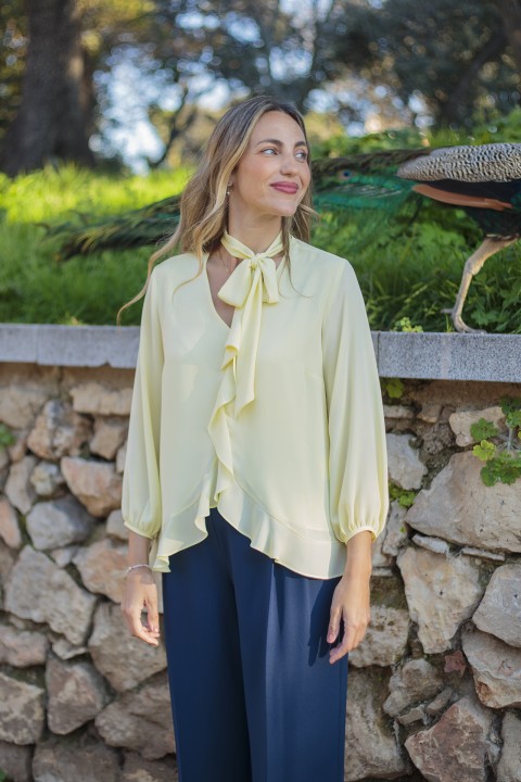 Blouse with ruffles and bow