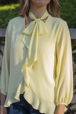 Blouse with ruffles and bow