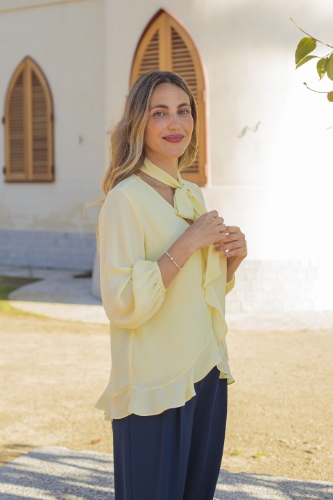 Blouse with ruffles and bow