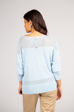 Knitted jumper with perforated areas