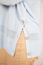 Knitted jumper with perforated areas