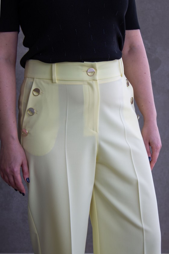 Trousers with silver buttons
