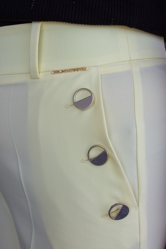 Trousers with silver buttons