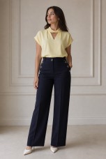 Trousers with silver buttons