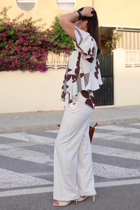 Blouse with an asymmetrical detail Blouse with an asymmetrical detail