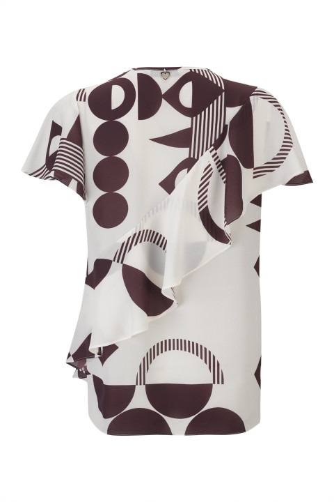 Blouse with an asymmetrical detail Blouse with an asymmetrical detail