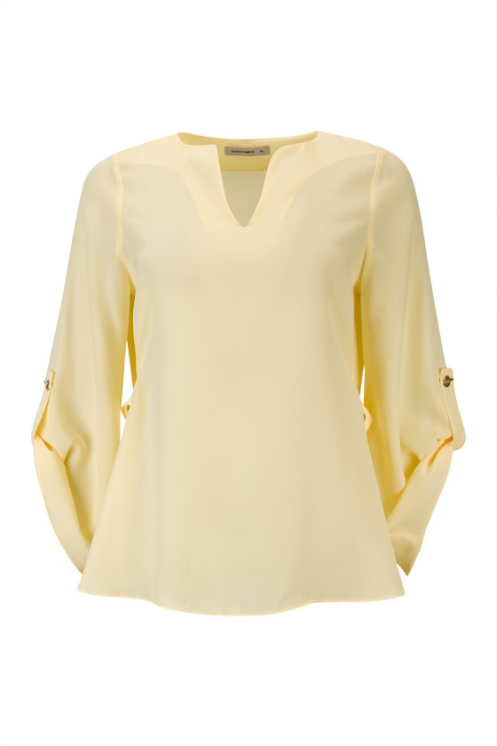 Blouse with gold eyelets