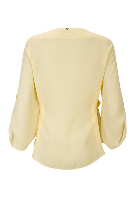 Blouse with gold eyelets