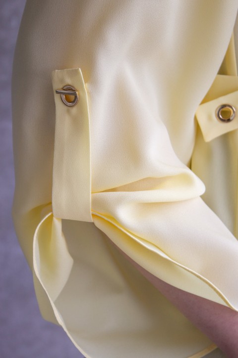 Blouse with gold eyelets Blouse with gold eyelets