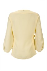 Blouse with gold eyelets