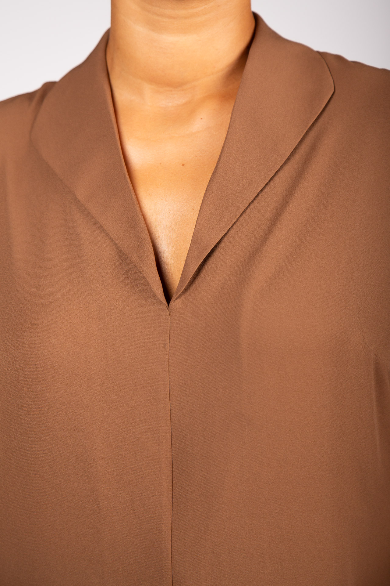 Tunic with ruffled sleeves