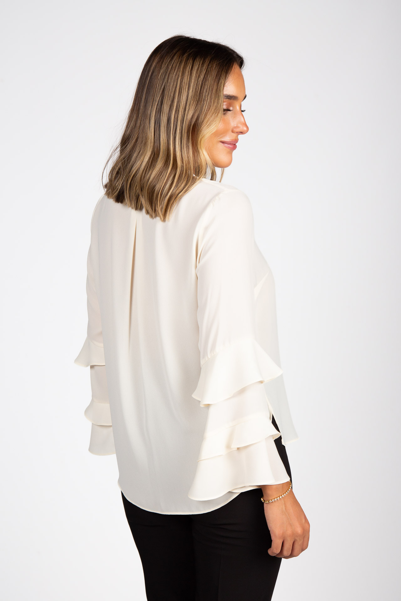 Tunic with ruffled sleeves