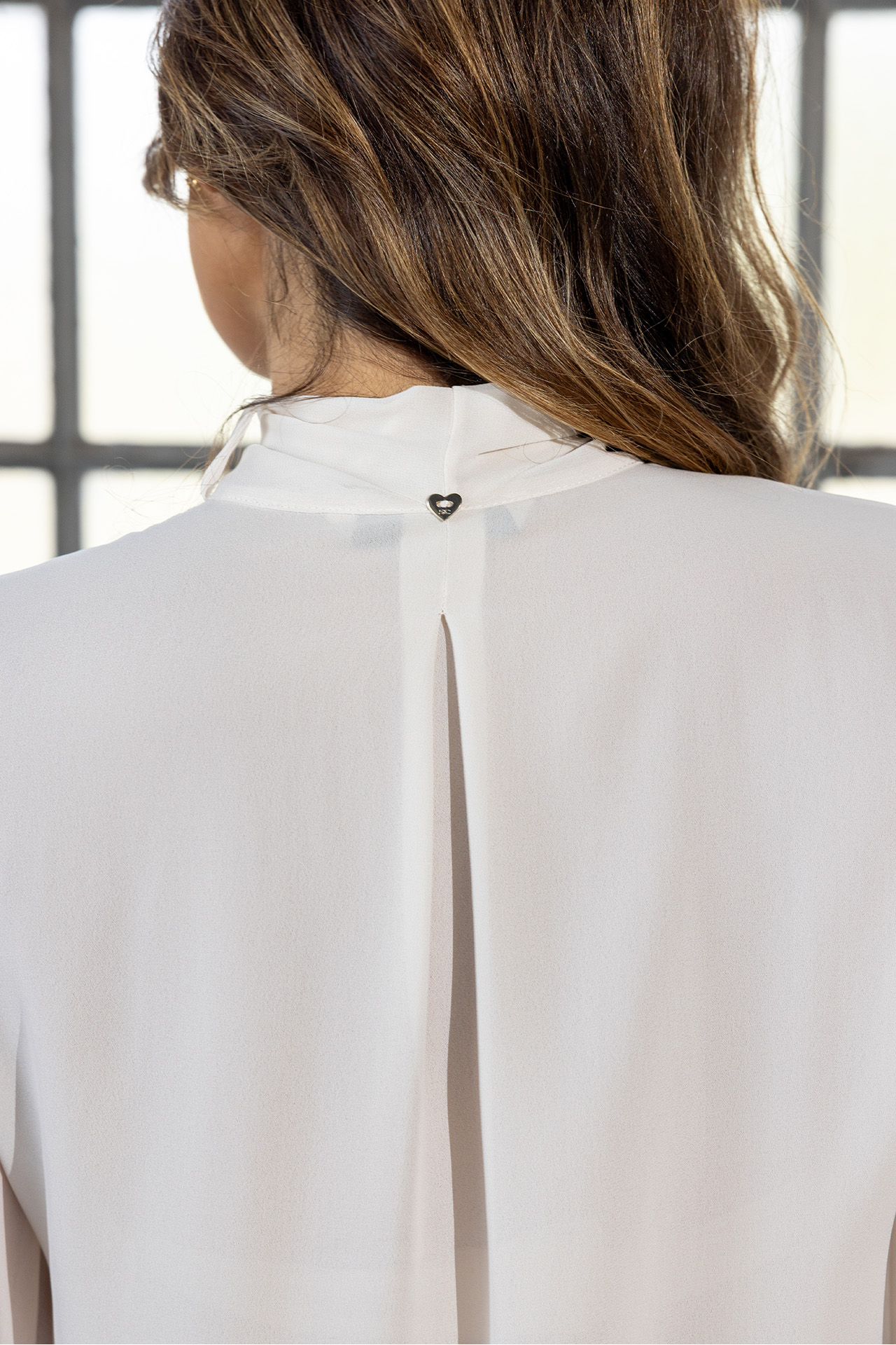 Tunic with a bow