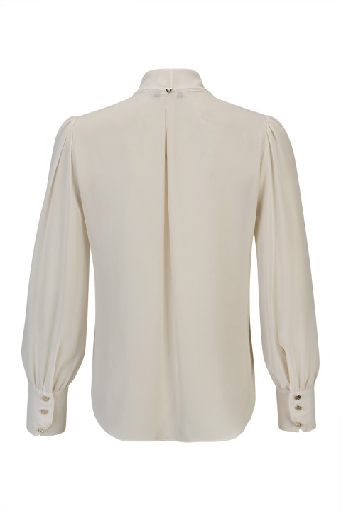 Tunic with a bow