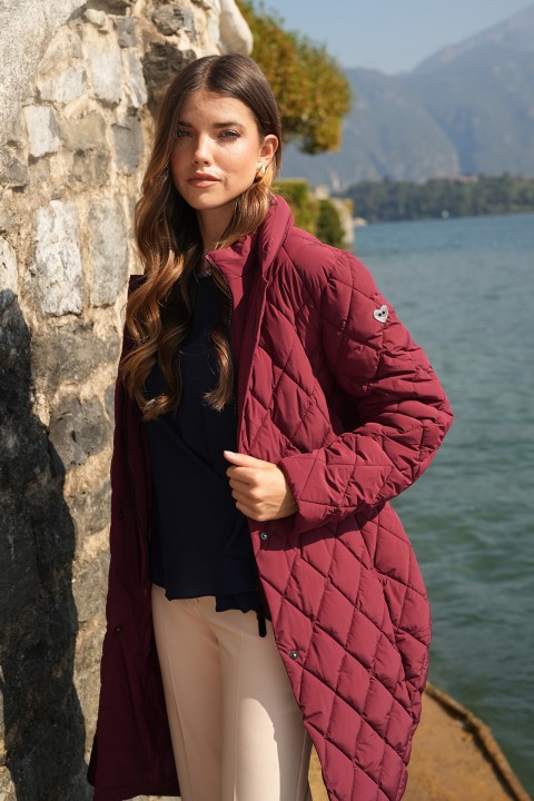Quilted parka with metal buckle belt